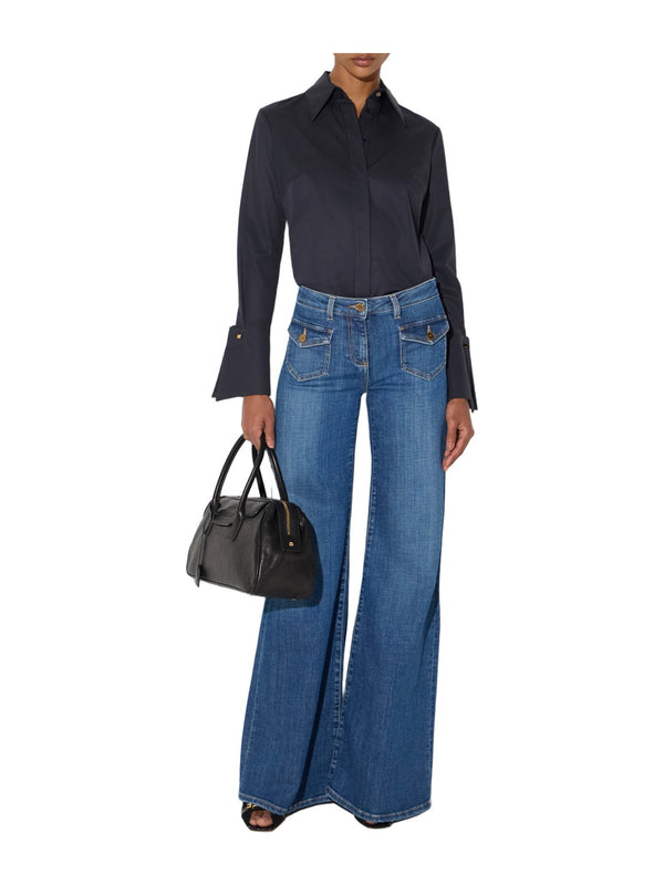 Jeans a zampa con taschini